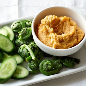 This is an easy way to add nutrients to a dip. Start with a container of store-bought hummus, then give it a healthy glow with vibrant sweet potato.