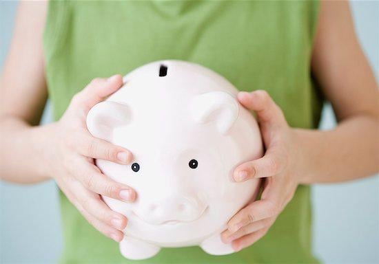 woman holding a piggy bank, money
