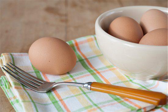 Egg on a counter, Bowl of boiled eggs with fork