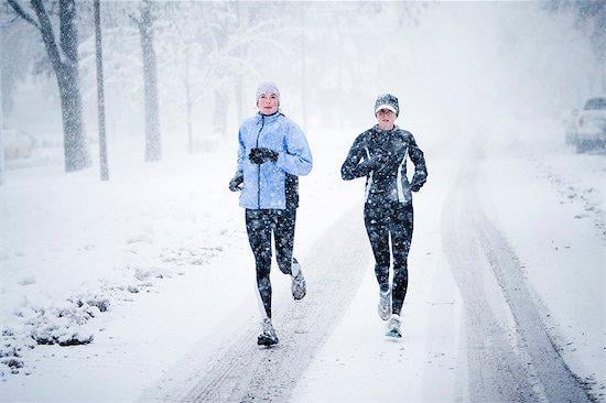 Women running in the snow