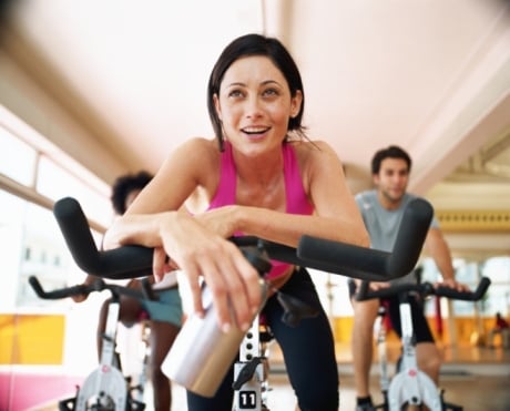 woman exercise on bike at gym