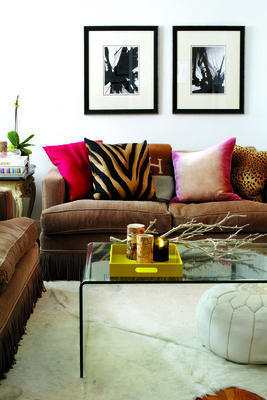 hot pink and animal print pillows on sofa