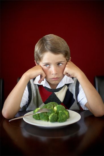 boy not wanting to eat his food, vegetables, veggies, broccoli