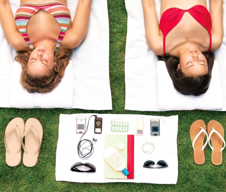 Two Girls Lying on Towels with Flip Flops