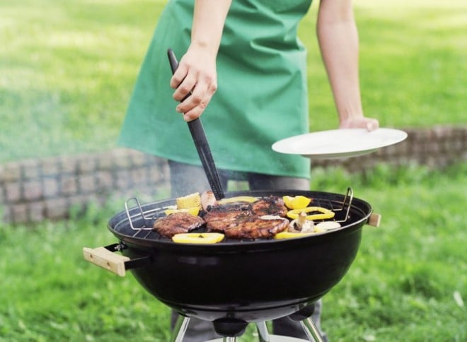 Woman grilling on the barbecue