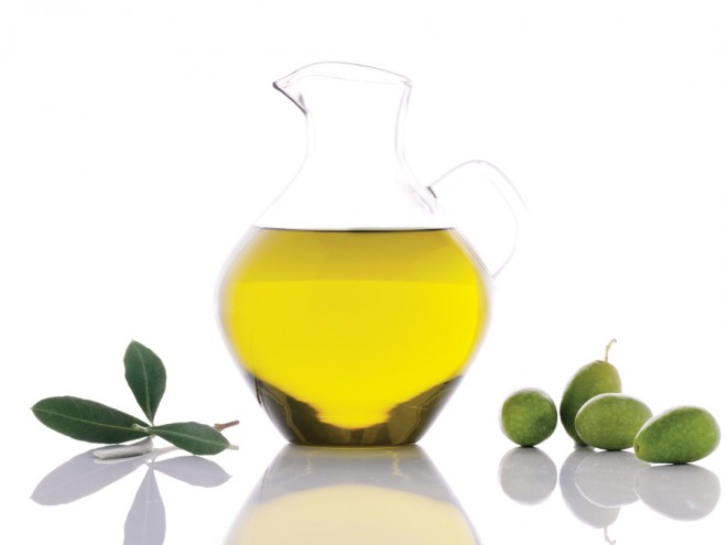 Bottle of olive oil with olives