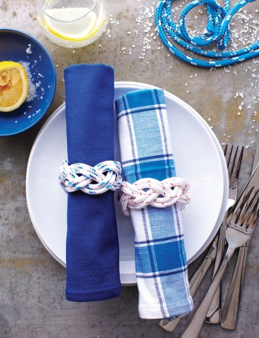 Place setting with blue and white napkins and plates