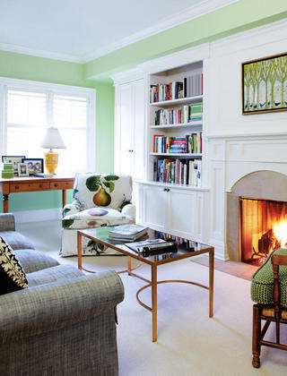 Living room, green wall, fireplace, white wall shelf
