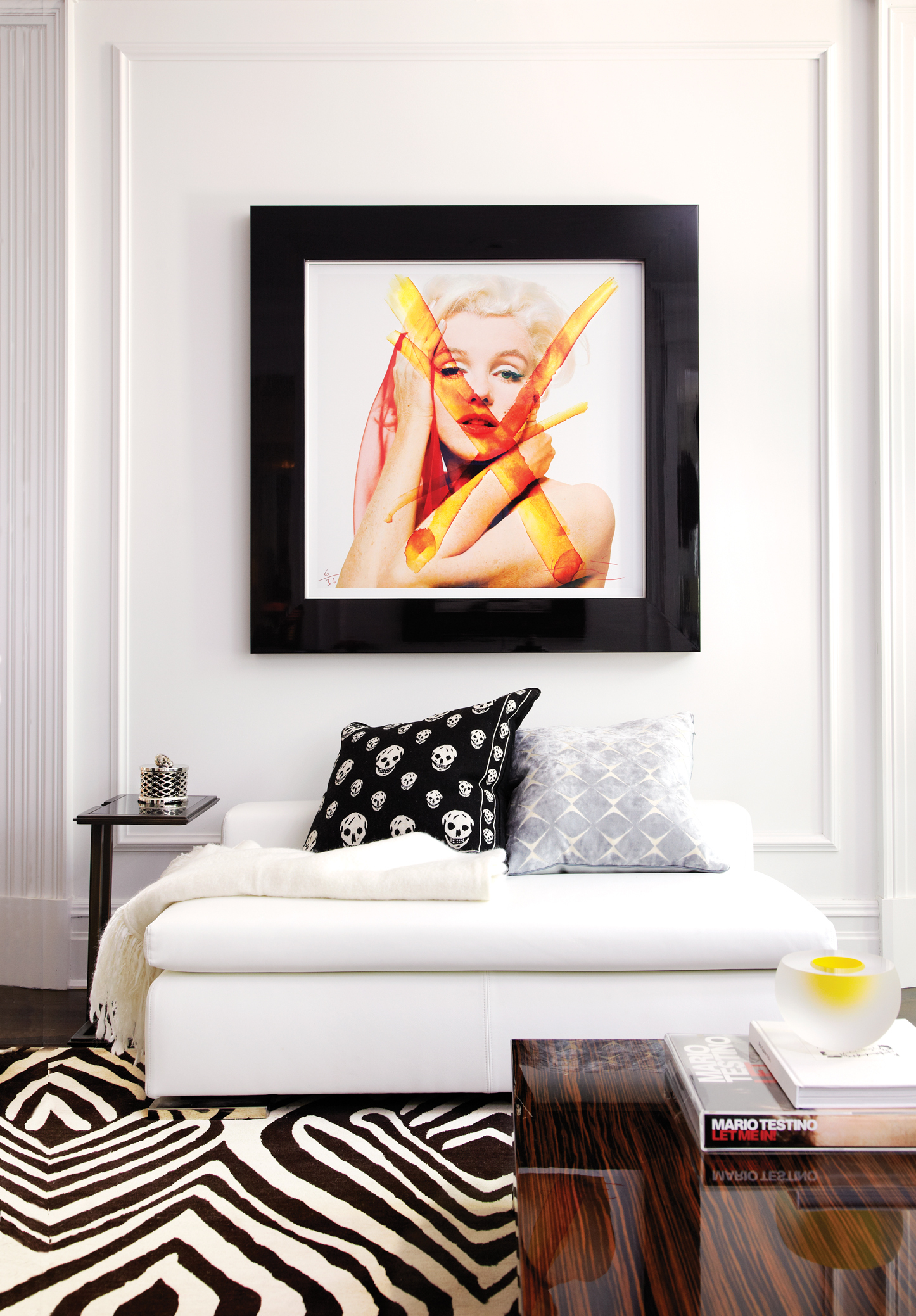 Living room, picture of Marilyn Monroe, Zebra rug, skull pillows, black and white