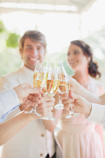 bride and groom, cheers and group of champagne flutes