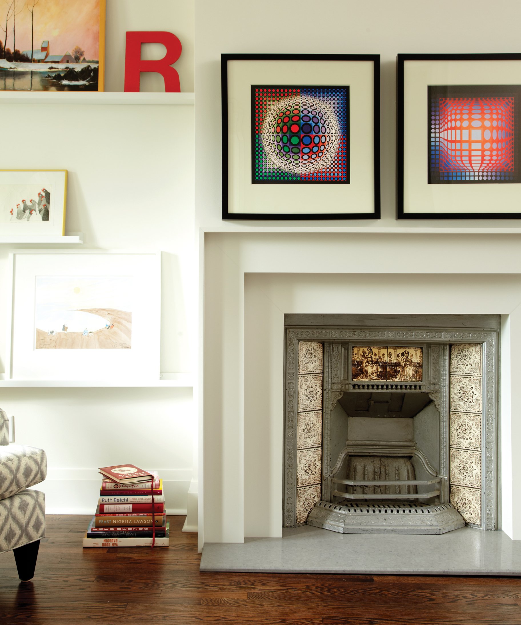 Living room, fireplace, graphic artwork