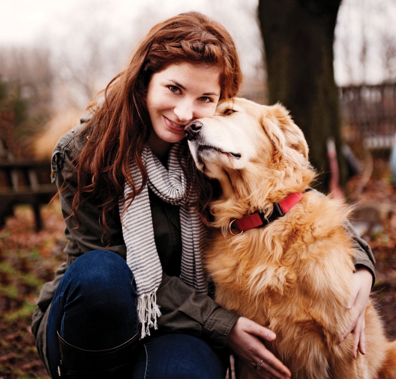 Woman and her golden retriever, fall