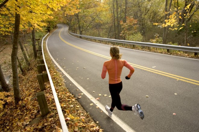 Woman running in the autumn