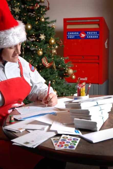 Canada post elf writing Santa letters