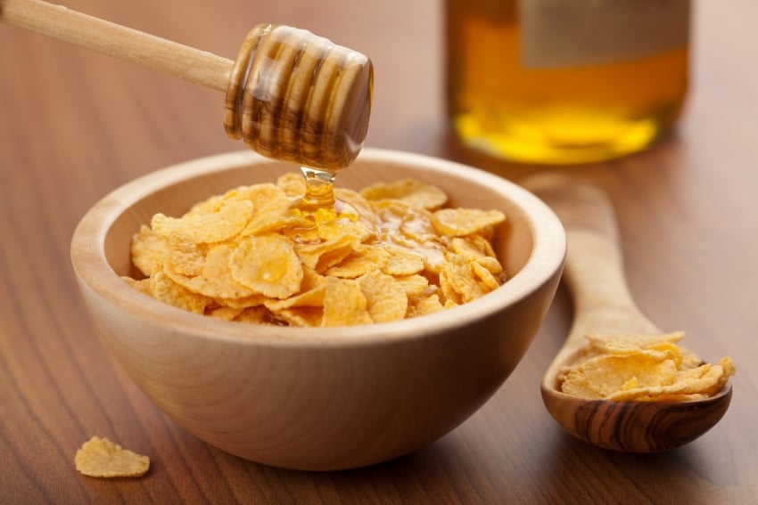 Cereal flakes with honey in a bowl