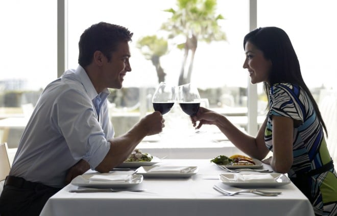 Couple drinking red wine at dinner