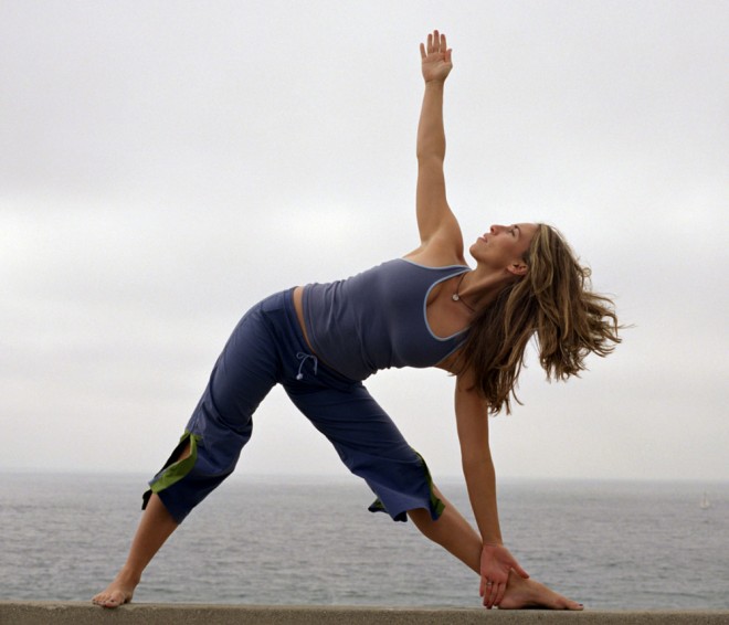 Triangle pose (shown here) can ease anxiety and is known to also improve digestion 