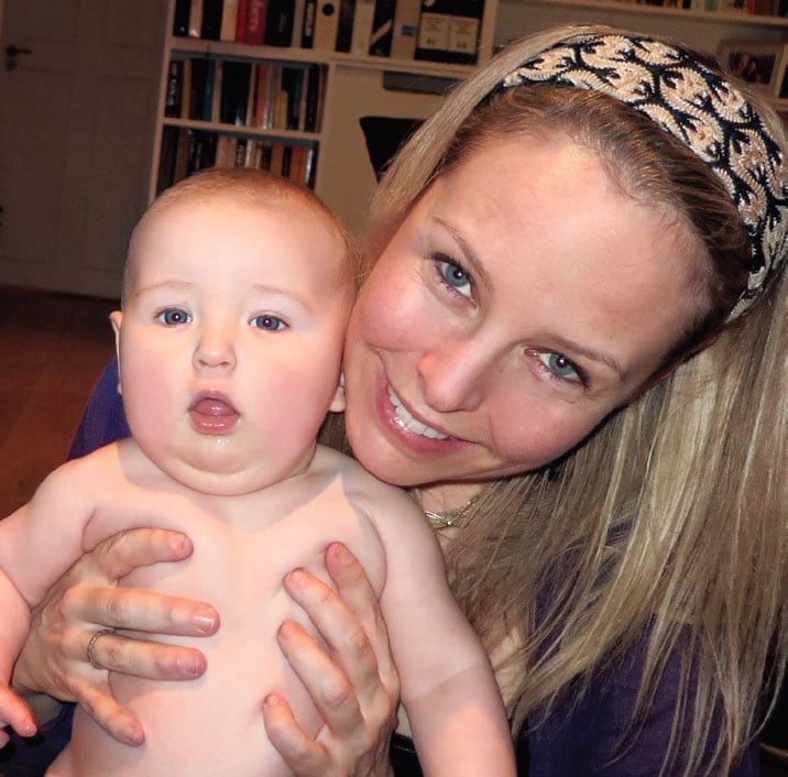 Leah at home with her six-month-old son, Solomon.