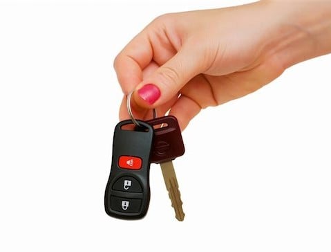 woman's hand holding car keys