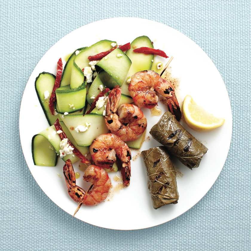 Grilled spiced shrimp and dolmades with zucchini salad