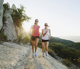 women walking up trail, exercise