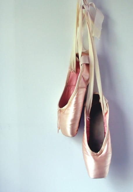 ballet shoes hanging on wall