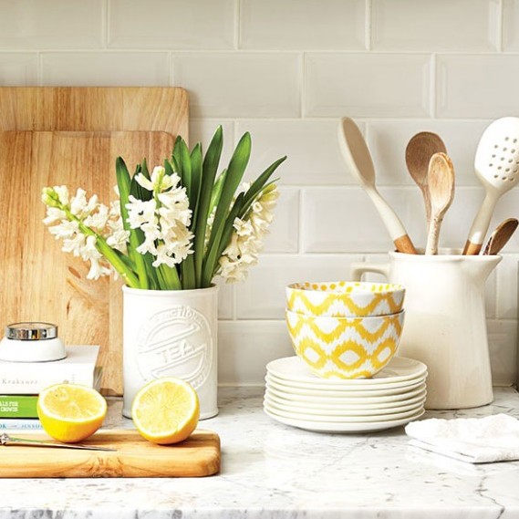 Feature-Photo-Marble-Counter-with-Cutting-Board-Ladels-Plants