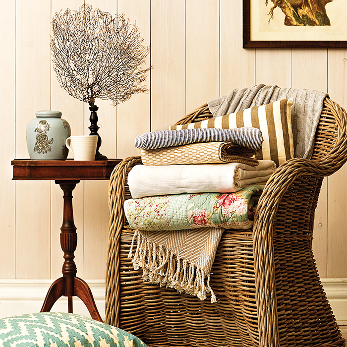 wicker chair with linens summer cottage decor