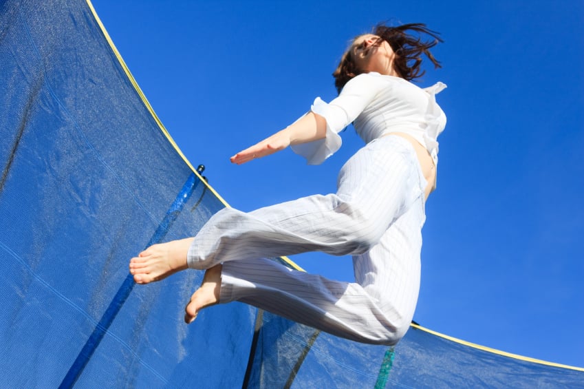 woman jumping trampoline fitness.