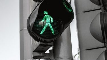 walking-walk symbol on traffic light