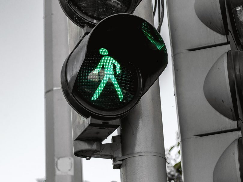 walking-walk symbol on traffic light