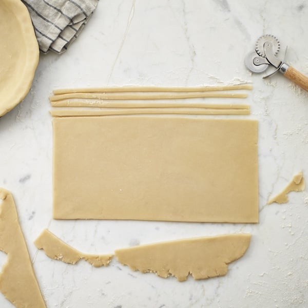 Cutting pie pastry into strips