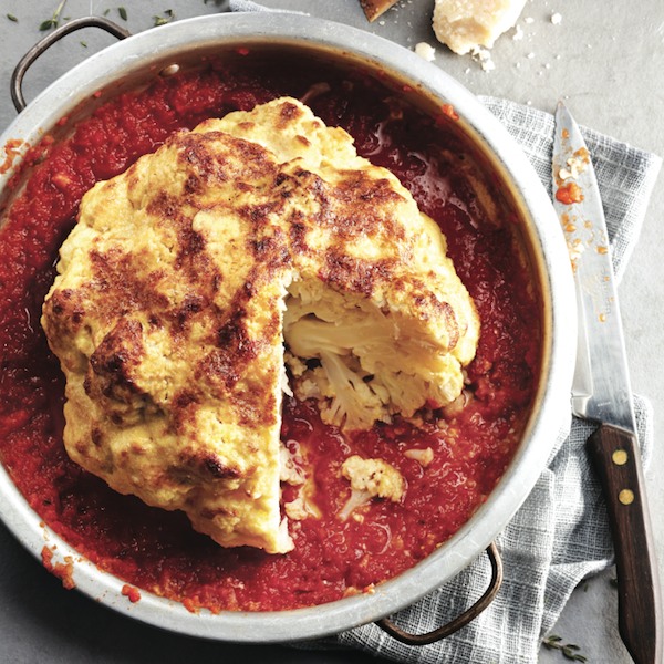 Whole-roasted cauliflower with tomato-pepper sauce