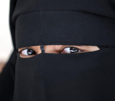 A Muslim woman wearing the niqab (veil which covers the body and leaves only a small strip for the eyes) poses during a meeting with Imam Ali El Moujahed on May 18, 2010 in Montreuil, outside Paris. The French parliament unanimously adopted on May 11, 2010 a resolution condemning the full-face Islamic veil as an affront to the nation's values. AFP PHOTO FRED DUFOUR (Photo credit should read FRED DUFOUR/AFP/Getty Images)