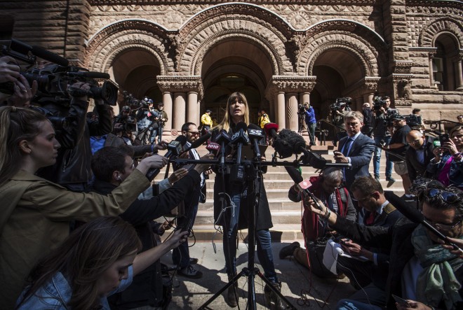 Kathryn Borel, a former colleague of Jian Ghomeshi who accused him of sexually assaulting her, speaks to the media after she agreed to a peace bond for Ghomeshi. THE CANADIAN PRESS/Mark Blinch