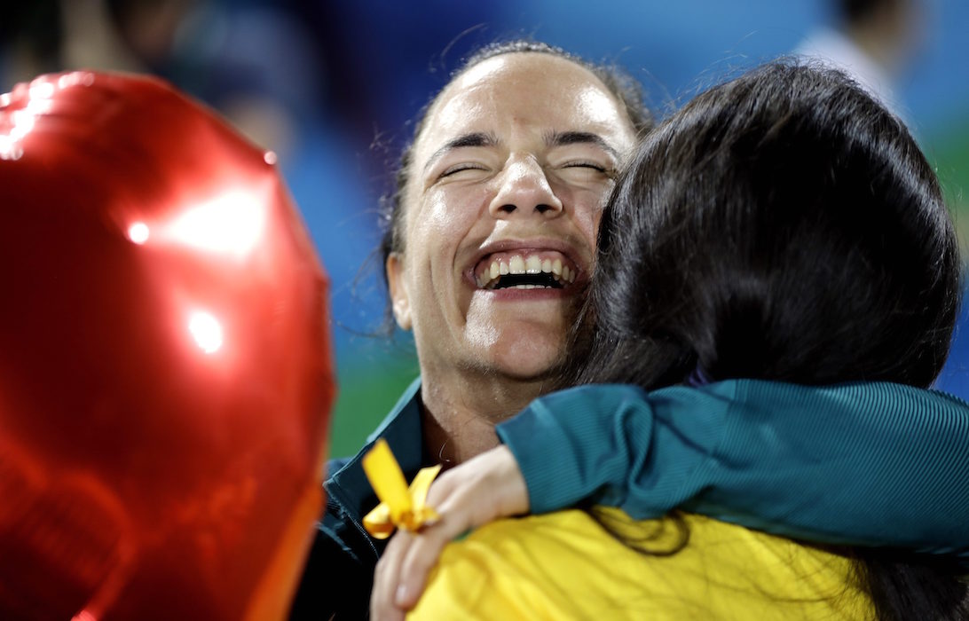 Olympic proposal: Brazil's Isadora Cerullo, shares a moment with her partner Marjorie Enya, after she was asked to marry her at the end of the medal ceremony for the women's rugby sevens match at the Summer Olympics in Rio de Janeiro, Brazil, Monday, Aug. 8, 2016. (AP Photo/Themba Hadebe)