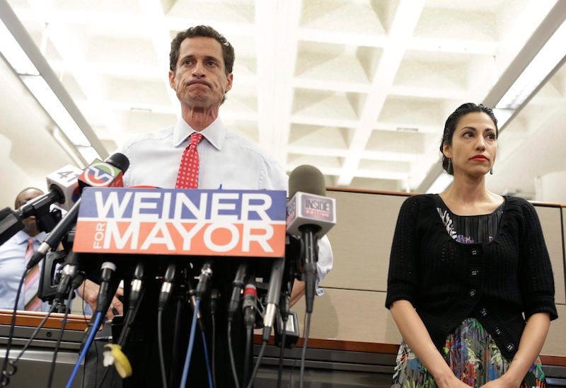 Huma Abedin stands beside Anthony Weiner as he addresses sexting allegations.