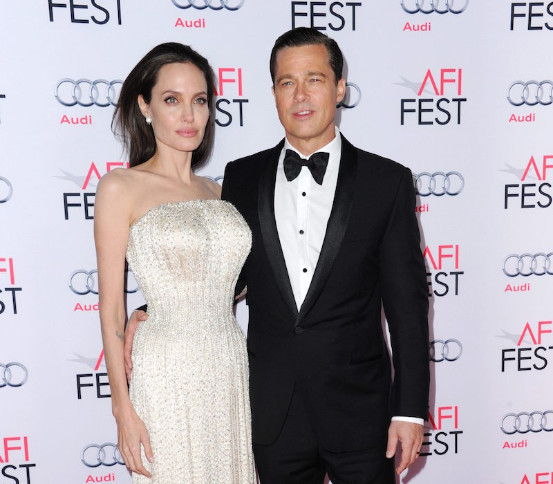 Angelina Jolie, left, and Brad Pitt arrive at the 2015 AFI Fest opening night premiere of "By The Sea" on Thursday, Nov. 5, 2015, in Los Angeles. (Photo by Richard Shotwell/Invision/AP)