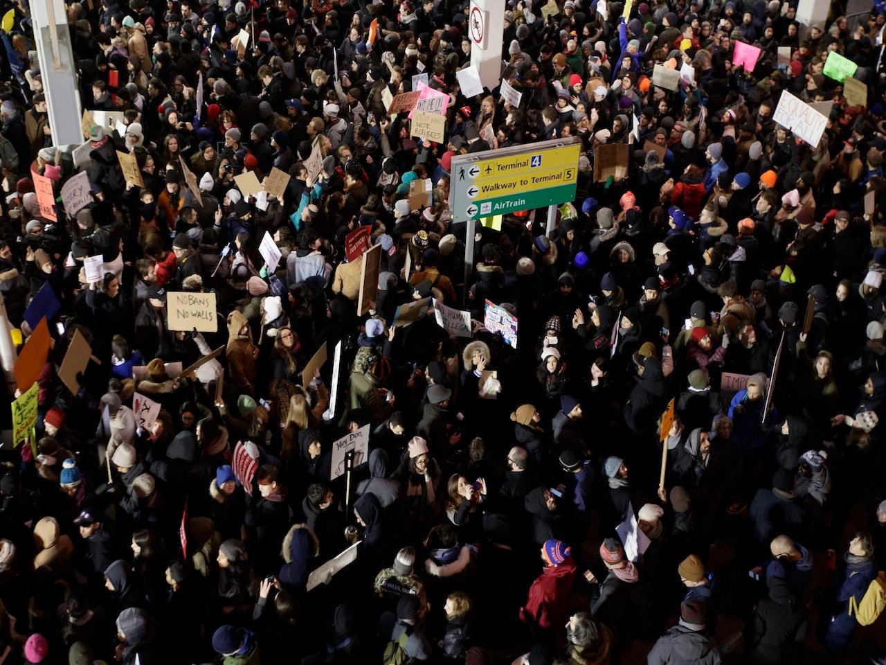 People gather for a protest at Terminal 4 of John F. Kennedy Airport in New York. Photo, EPA/Justin Lane. 