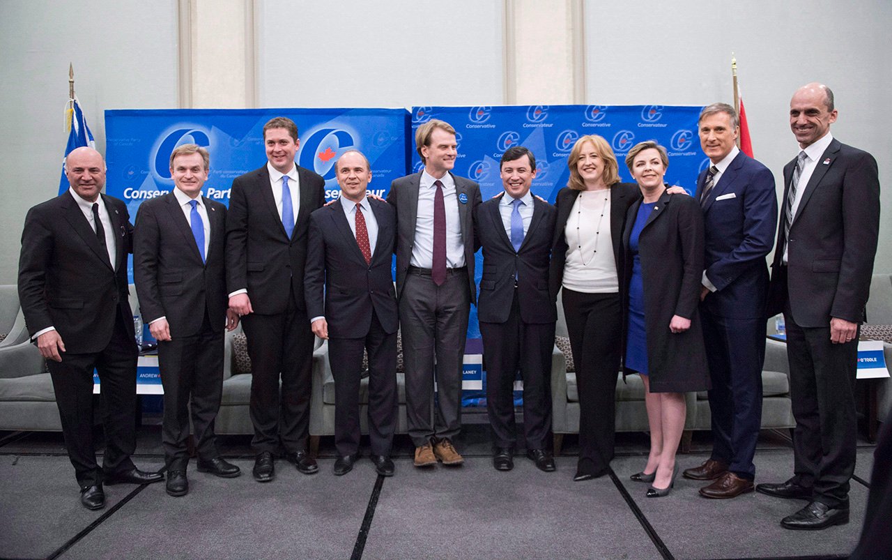 Conservative Party leadership candidates Kevin O'Leary, Andrew Saxton, Andrew Sheer, Rick Petterson, Chris Alexander, Michael Chong, Lisa Raitt, Kelie Leitch, Maxime Bernier and Steven Blaney, left to right, stand for a photo prior to a debate Monday, February 13, 2017 in Montreal. (Paul Chiasson / The Canadian Press)
