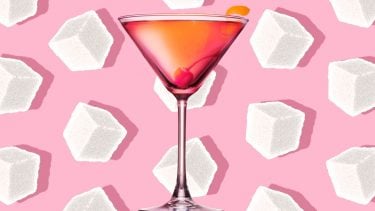 reduce sugar: a sugary martini sits on a background of sugar cubes