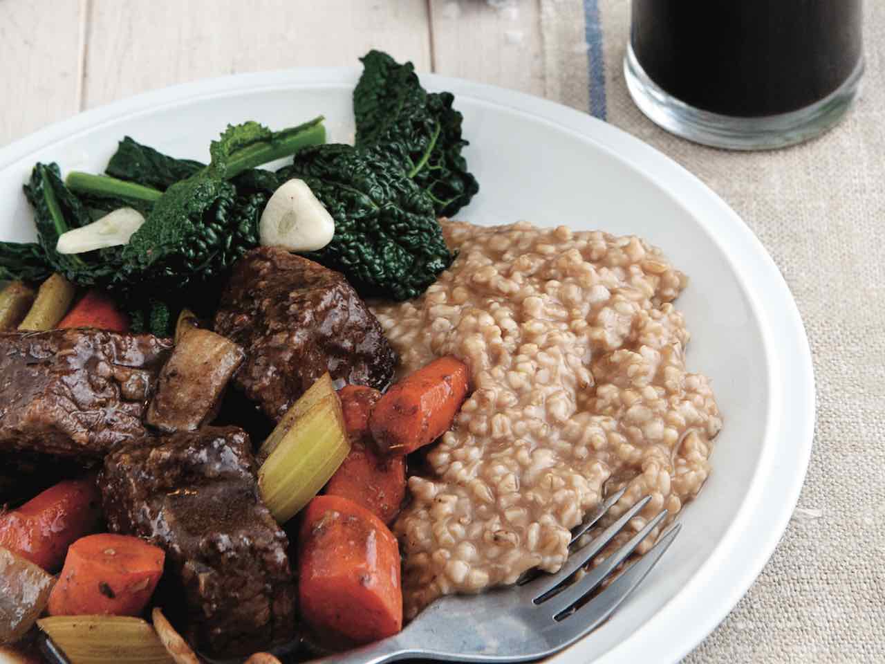 Stout-braised beef stew, oat risotto and Emerald Isle greens