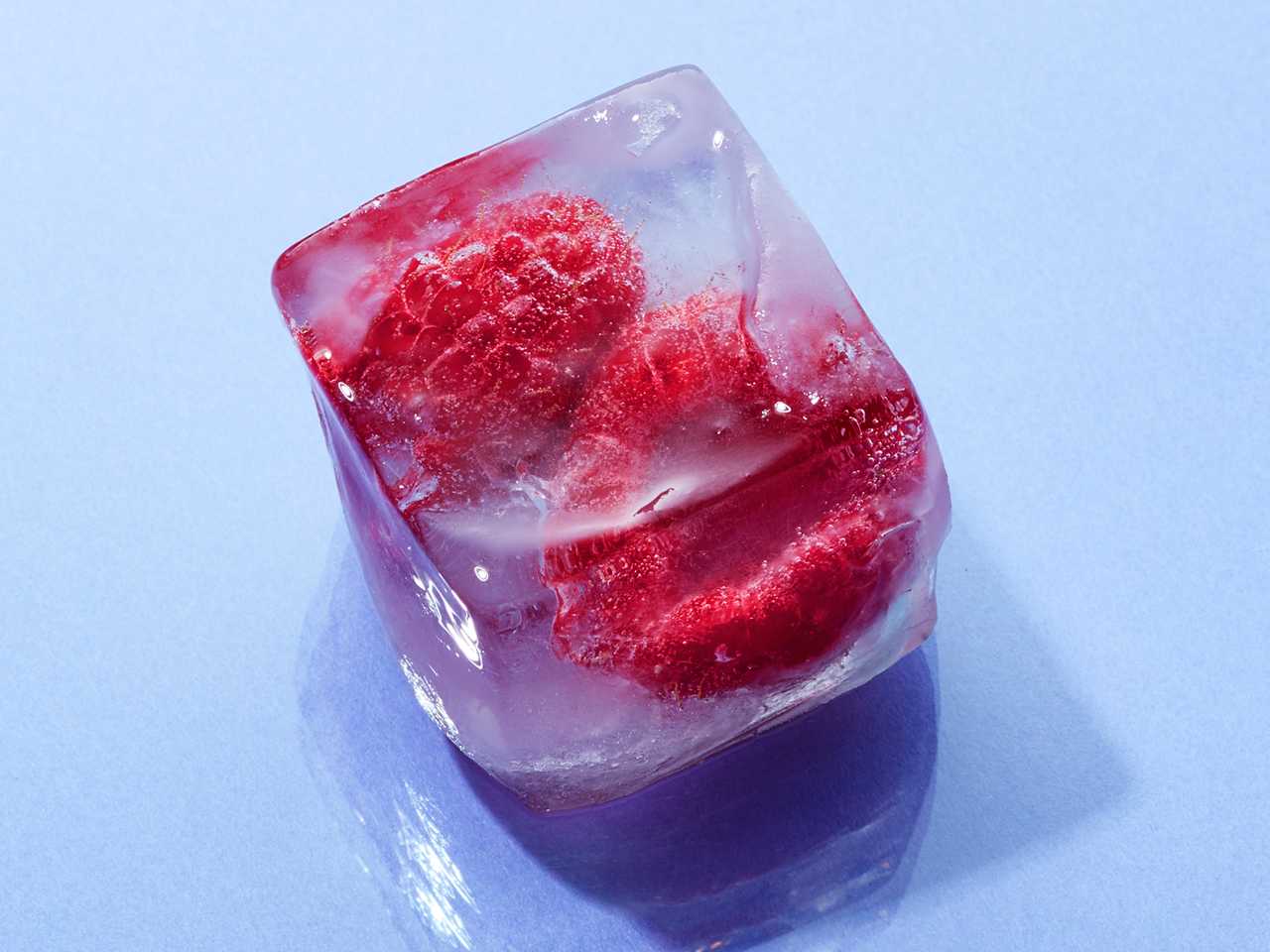 ice cube with raspberries inside