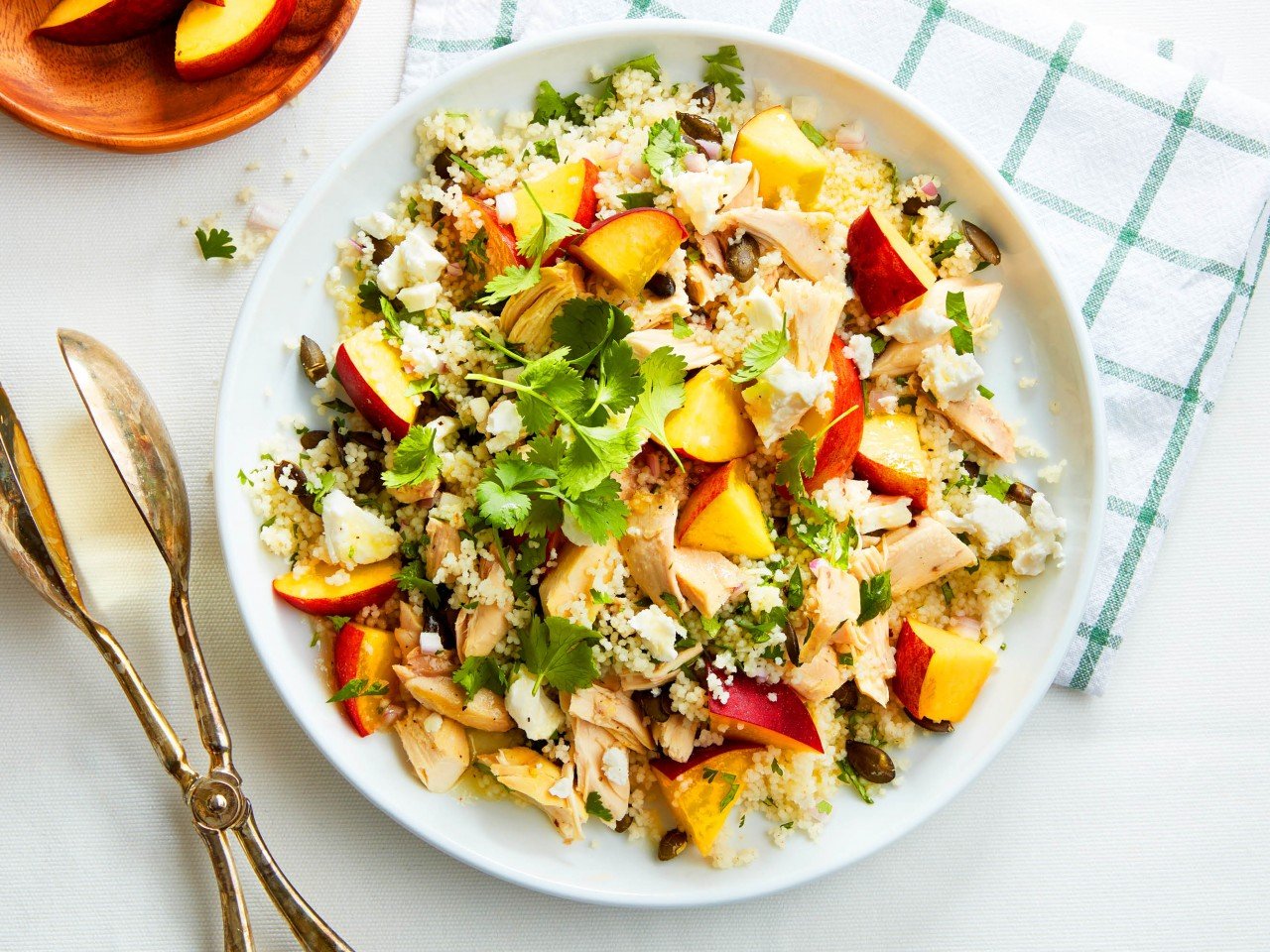 Peach and chicken couscous salad on a plate/