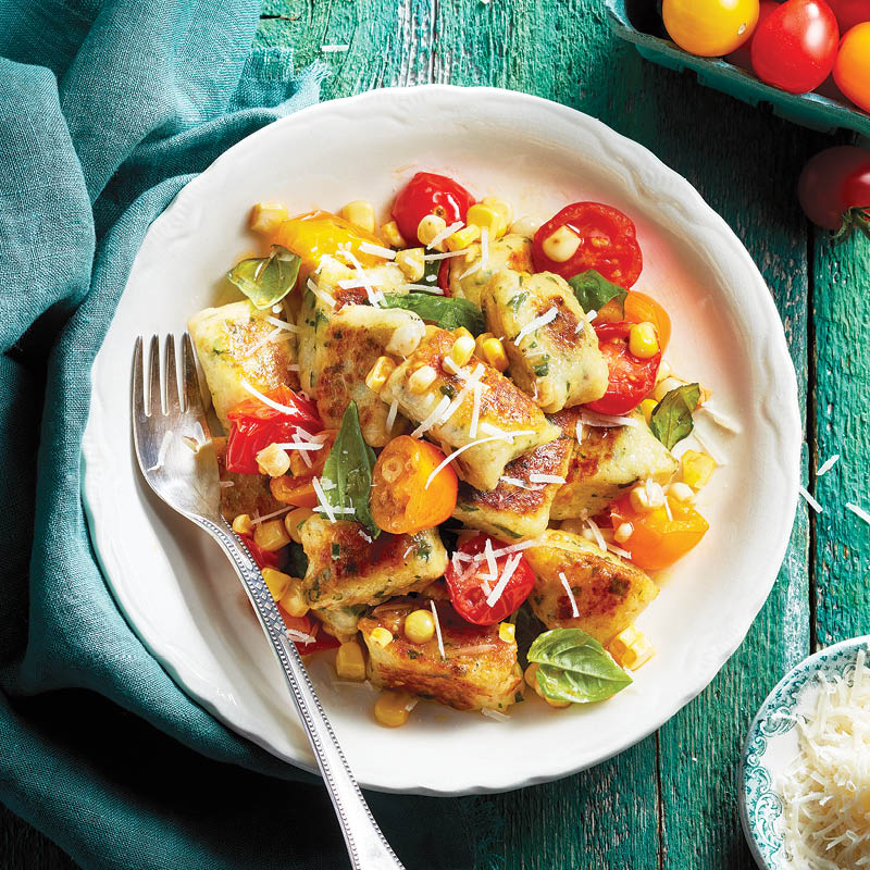 Fresh ricotta gnocchi with tomato and corn salad