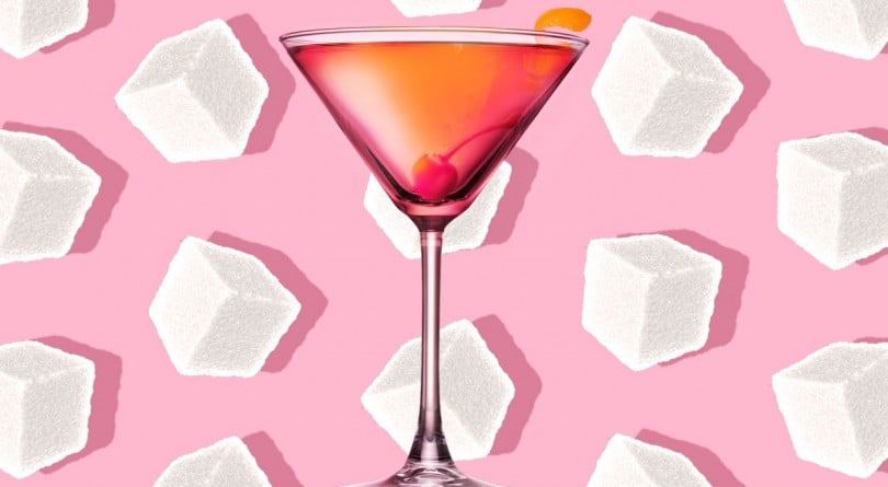 low sugar cocktails - martini glass surrounded by sugar cubes