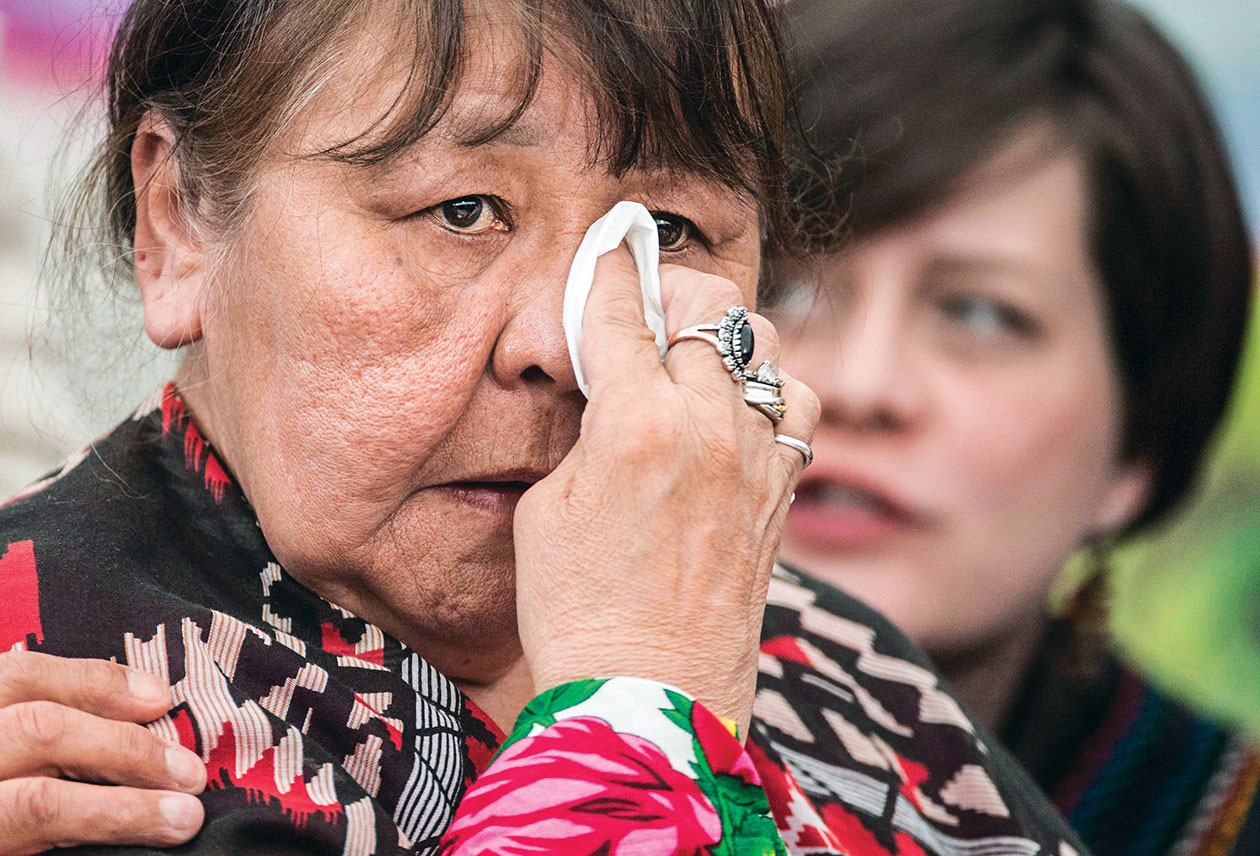 MMIW Inquiry: Bella Bresse wipes away a tear as she speaks about her murdered daughter, Evangeline Billy, at the National Inquiry into Missing and Murdered Indigenous Women and Girls taking place in Whitehorse, YT. on May 31, 2017. (Photo, Jonathan Hayward/CP)