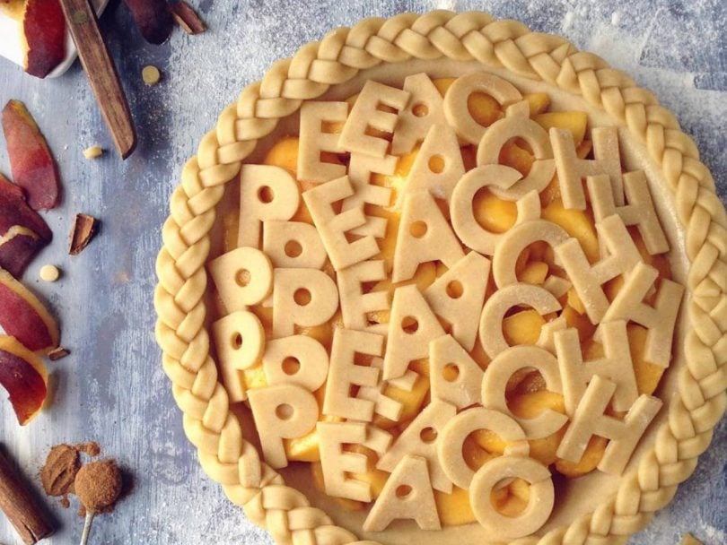Intricate pie crusts: peach pie with alphabet crust topping