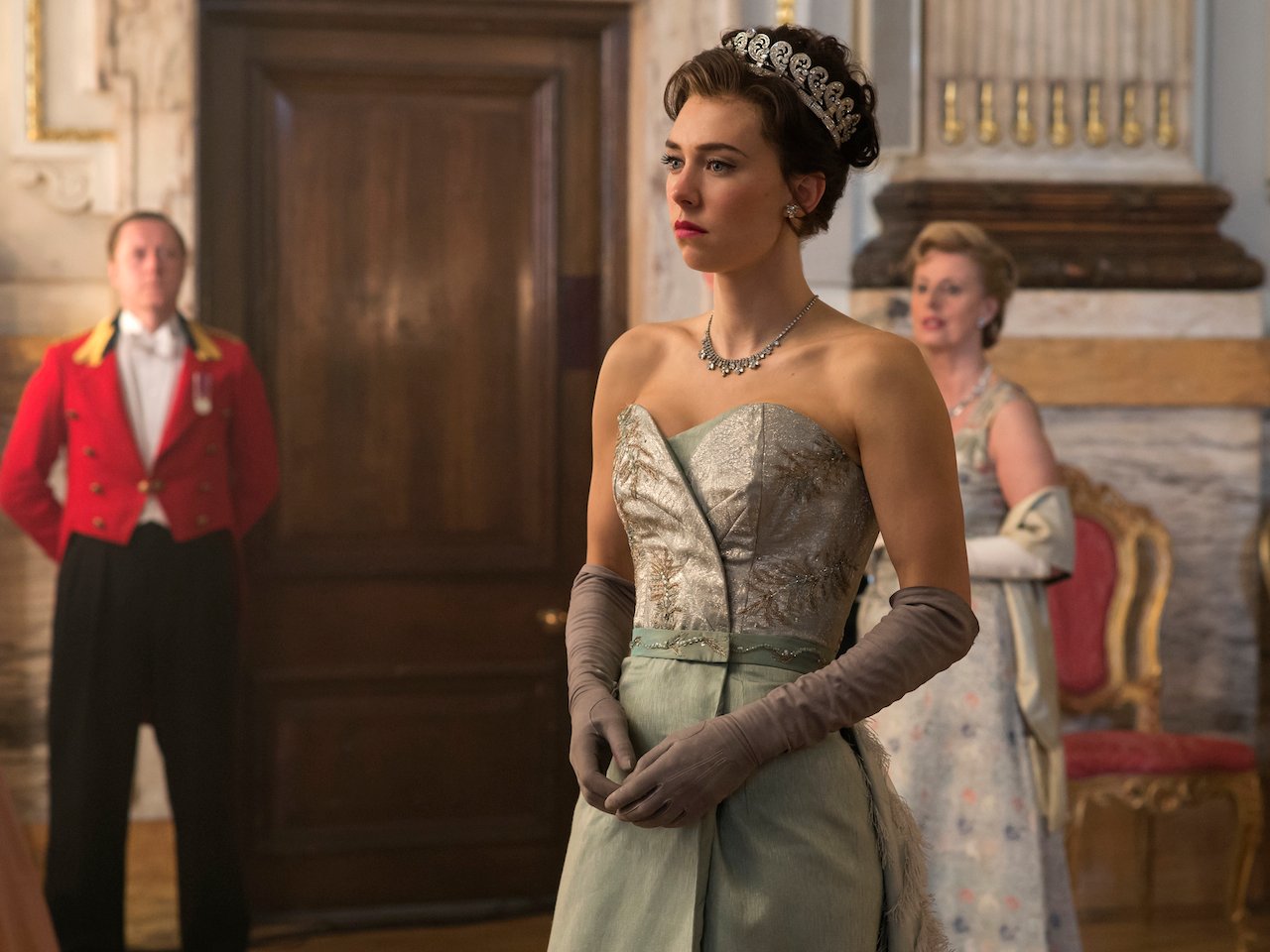  The Crown season 2 royals - Still shows Margaret, upset, as she arrives at the celebration in Queen Elizabeth II and Prince Philip's honour. 