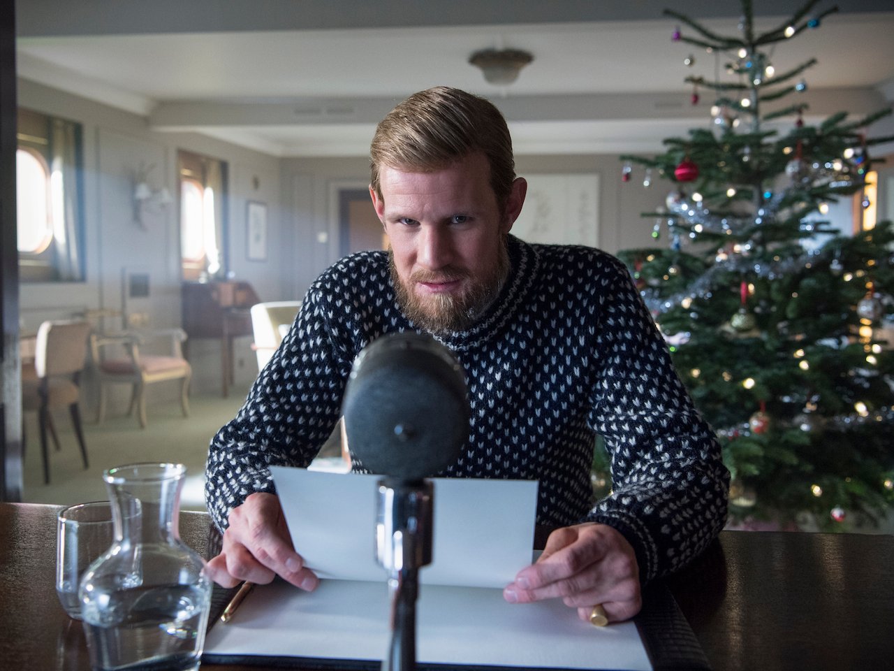  The Crown season 2 royals- still of Philip as he prepares to deliver his Christmas address over the radio